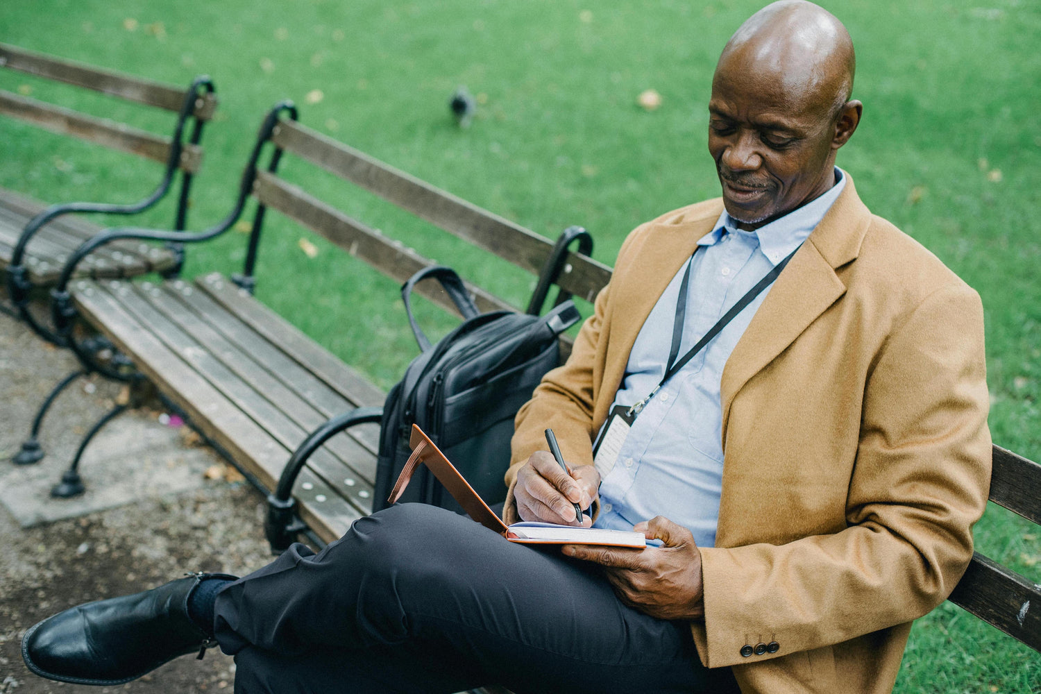 Man writing in limited edition notebook